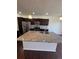 A modern kitchen featuring stainless steel appliances, granite counters and a large island at 14883 E Crestridge Dr, Centennial, CO 80015