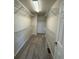 A spacious walk-in closet with ample shelving and carpeting at 14883 E Crestridge Dr, Centennial, CO 80015