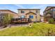Enjoy the backyard with a deck, well-maintained lawn, and easy access to the house at 18083 Telford Ave, Parker, CO 80134