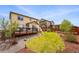 A home with a backyard featuring a deck, a grassy area, and low-maintenance landscaping at 18083 Telford Ave, Parker, CO 80134