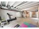 Unfinished basement featuring exposed ceiling, water heater, and space for a home gym at 18083 Telford Ave, Parker, CO 80134