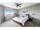 Inviting bedroom with large window offering scenic views and a ceiling fan at 18083 Telford Ave, Parker, CO 80134