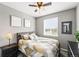 Cozy bedroom with a large window and ceiling fan at 18083 Telford Ave, Parker, CO 80134