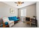 Comfortable bedroom with a futon sofa and a ceiling fan at 18083 Telford Ave, Parker, CO 80134