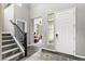 Welcoming entryway featuring hardwood floors, staircase, and an open layout with seamless transition to other living areas at 18083 Telford Ave, Parker, CO 80134