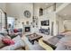Bright living room boasts a fireplace, high ceilings, and comfortable seating at 5722 S Flat Rock Way, Aurora, CO 80016