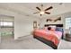 Bright main bedroom with ceiling fan, adjoining space, and plush bedding at 5722 S Flat Rock Way, Aurora, CO 80016