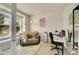 Cozy home office with a comfortable seating area and a functional workspace at 5722 S Flat Rock Way, Aurora, CO 80016