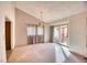 Cozy dining room featuring carpeted floors, a chandelier, and sliding glass door to the backyard at 11946 E Maple Ave, Aurora, CO 80012