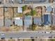 An aerial view of several single-Gathering homes with small yards and tree coverage on a sunny day at 1130 S Harrison St, Denver, CO 80210