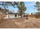 Large backyard with a fire pit, a modern pergola, and fresh landscaping, creating an inviting outdoor living space at 1130 S Harrison St, Denver, CO 80210