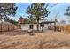 Spacious backyard with a fire pit, modern pergola, and privacy fence for outdoor enjoyment at 1130 S Harrison St, Denver, CO 80210