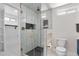Beautiful glass enclosed shower with gold fixtures, sleek design, and ample natural light at 1130 S Harrison St, Denver, CO 80210