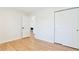 Bright bedroom featuring hardwood floors and a closet at 1130 S Harrison St, Denver, CO 80210