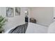 Bright bedroom with neutral tones, stylish decor, and a glimpse into the en-suite bathroom at 1130 S Harrison St, Denver, CO 80210