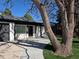 The front entrance boasts a black door and trim with ample parking at 1130 S Harrison St, Denver, CO 80210