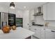 Modern kitchen with white cabinets, sleek appliances, and stylish island is an inviting space at 1130 S Harrison St, Denver, CO 80210