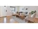 Bright living room featuring hardwood floors and an inviting seating arrangement at 1130 S Harrison St, Denver, CO 80210