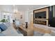 Bright living room featuring a modern fireplace and ample seating at 1130 S Harrison St, Denver, CO 80210