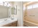 Bathroom with a single sink vanity and shower and tub combo at 3512 S Kittredge St # C, Aurora, CO 80013