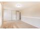Large bedroom featuring carpet, sliding closet doors, and access to the hallway at 3512 S Kittredge St # C, Aurora, CO 80013