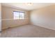 Cozy bedroom features carpet flooring and a window for natural light at 3512 S Kittredge St # C, Aurora, CO 80013