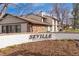 Sign for Seville, a covenant controlled community, set against a brick wall and mulch at 3512 S Kittredge St # C, Aurora, CO 80013