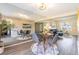 Bright dining area integrates seamlessly with the living room featuring a stylish table and mirrored wall at 3512 S Kittredge St # C, Aurora, CO 80013