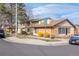 Townhome at the corner of S Ithaca and E Cornell with brick accents and landscaping at 3512 S Kittredge St # C, Aurora, CO 80013