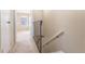 Upstairs hallway with neutral carpet, leading to bedrooms and a window view at 3512 S Kittredge St # C, Aurora, CO 80013