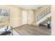 Sunlit living area featuring sleek floors, modern staircase, and neutral walls for a versatile living space at 3512 S Kittredge St # C, Aurora, CO 80013