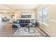 Bright living room with a comfortable sofa, neutral tones, and large windows that enhance the inviting atmosphere at 3512 S Kittredge St # C, Aurora, CO 80013