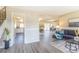 Open floor plan featuring a modern kitchen, a spacious living room and a mirrored wall to the dining room at 3512 S Kittredge St # C, Aurora, CO 80013