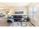 Bright living room with a comfortable sofa, neutral tones, and large windows that enhance the inviting atmosphere at 3512 S Kittredge St # C, Aurora, CO 80013