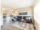 Cozy living area featuring a stylish sofa, a dining room with a mirrored wall, and elegant decor at 3512 S Kittredge St # C, Aurora, CO 80013