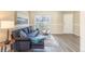 Bright living room features a stylish sofa, contemporary decor, and plenty of natural light at 3512 S Kittredge St # C, Aurora, CO 80013