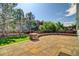 Stone patio with stone seating wall and green space at 8416 S Reed St, Littleton, CO 80128