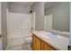 Bathroom with shower-tub combination, sink and tile flooring at 8416 S Reed St, Littleton, CO 80128