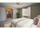 Comfortable main bedroom with ensuite bathroom offers lots of space and natural light at 8416 S Reed St, Littleton, CO 80128