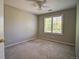 Neutral bedroom with carpet, fan and bright shuttered windows at 8416 S Reed St, Littleton, CO 80128