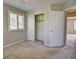 Bedroom with closet and view into an additional room at 8416 S Reed St, Littleton, CO 80128