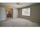 Comfortable secondary bedroom with ensuite bathroom offers lots of space and natural light at 8416 S Reed St, Littleton, CO 80128