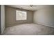 The spacious bedroom offers a neutral color palette and plenty of natural light at 8416 S Reed St, Littleton, CO 80128
