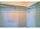 Walk-in closet with clothing rack and shelf for organized storage at 8416 S Reed St, Littleton, CO 80128