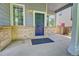 Charming front porch with brick accents and ample space for seating at 8416 S Reed St, Littleton, CO 80128
