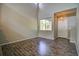 Bright and airy living room with high ceilings, hardwood floors, and large windows at 8416 S Reed St, Littleton, CO 80128