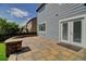 Back patio with stone pavers, stone border and backyard views perfect for relaxing outdoors at 8416 S Reed St, Littleton, CO 80128