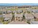 Real estate aerial showcases the neighborhood with nearby school and play fields at 3522 Harvard Pl, Broomfield, CO 80023