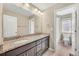 Bathroom showcasing granite double vanity and adjacent water closet with toilet and shower/tub at 3522 Harvard Pl, Broomfield, CO 80023