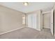 The bedroom has a window, carpet, and closet with sliding doors at 3522 Harvard Pl, Broomfield, CO 80023